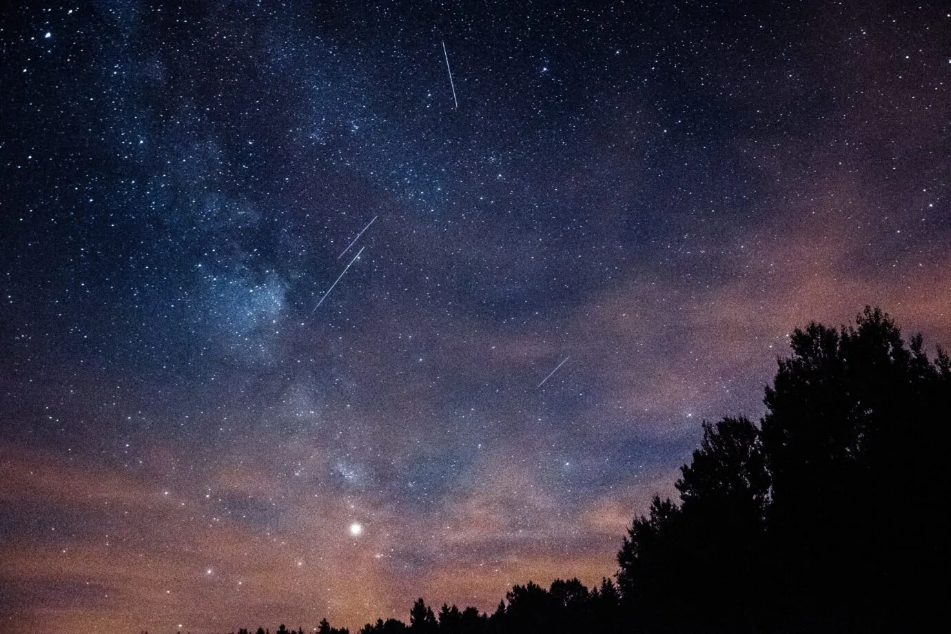 Wyoming sky at dusk with meteor shower.
